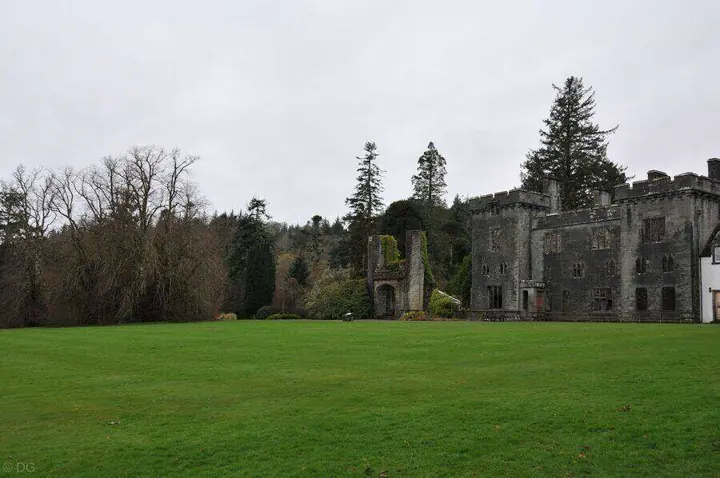 Armadale Castle's ruined walls across an expansive green lawn