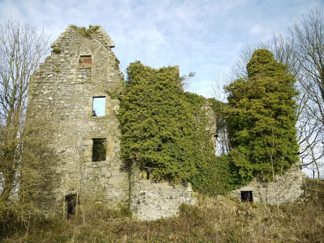 Auchans Castle roofless facade with ivy-covered sections