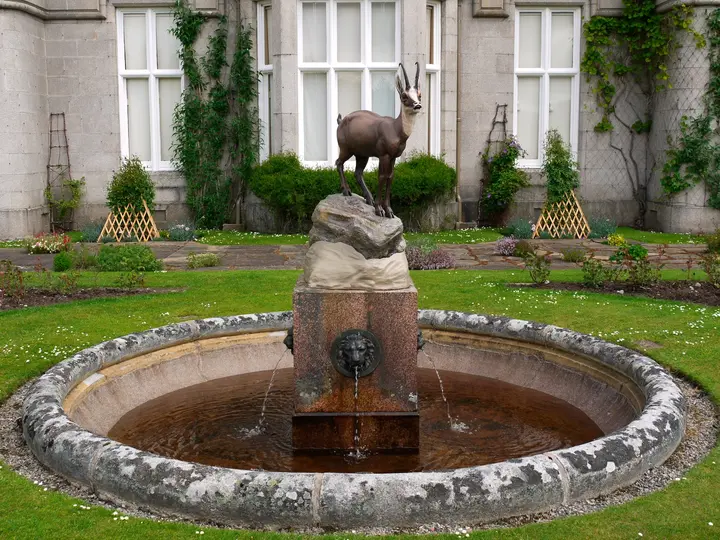 Circular fountain with a stag sculpture in the Balmoral Castle garden