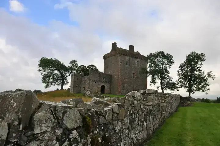 Stone boundary wall leading towards Balvaird Castle