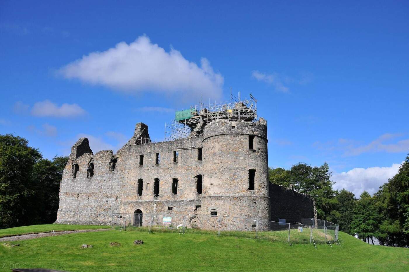 Balvenie Castle ruins with a round tower and scaffolding
