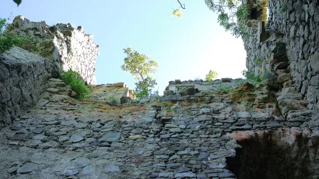 Open sky above the roofless stone interior of Carleton Castle