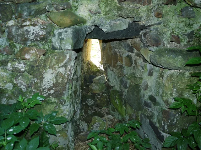 Narrow window opening in a thick stone wall at Carleton Castle