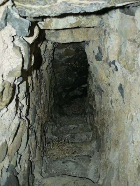 Dark recessed passage framed by thick stonework at Carleton Castle