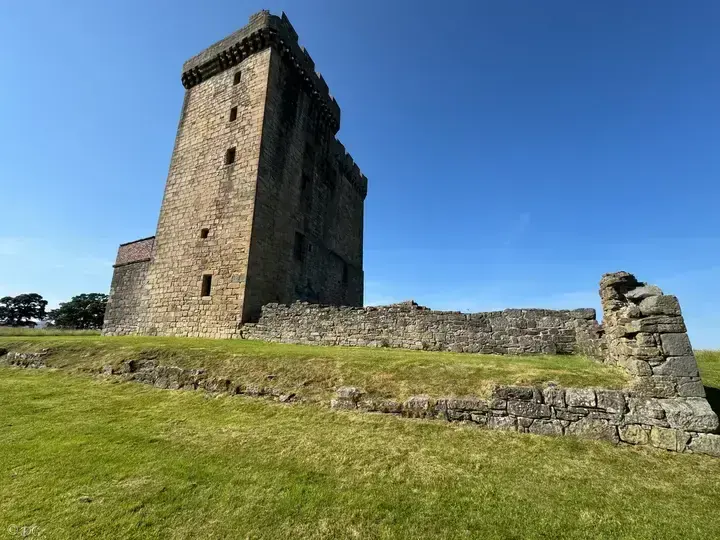 Clackmannan Tower above grassy terraces and ruined walls