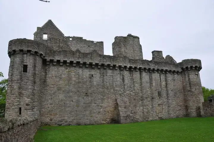Long stone wall between round towers at Craigmillar Castle