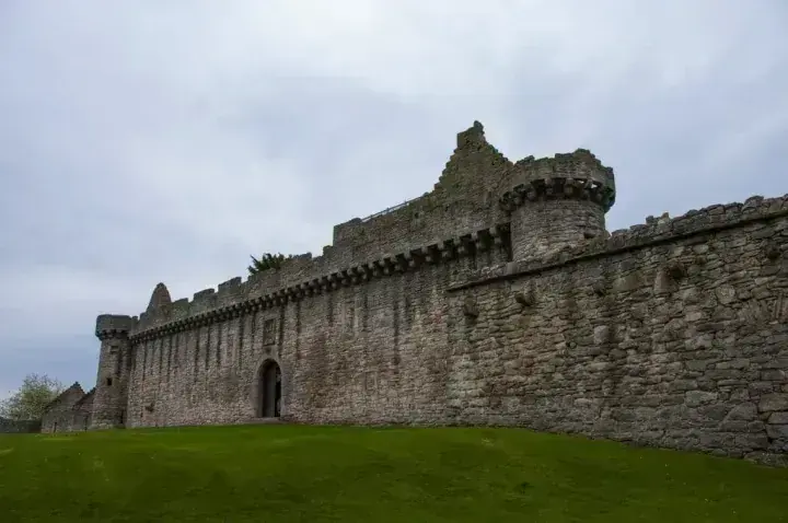 Craigmillar Castle arched entrance beneath tall stone walls