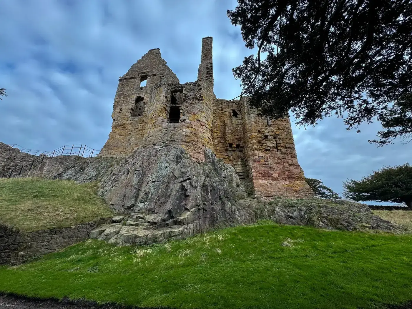 Dirleton Castle's ruined towers rising from a rocky outcrop