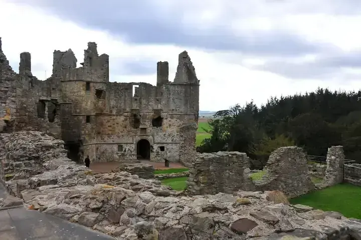 Roofless gables and low courtyard ruins at Dirleton Castle