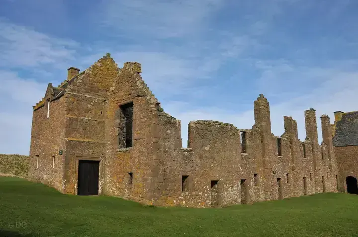 Dunnottar Castle stone range with a tall gable and rows of openings