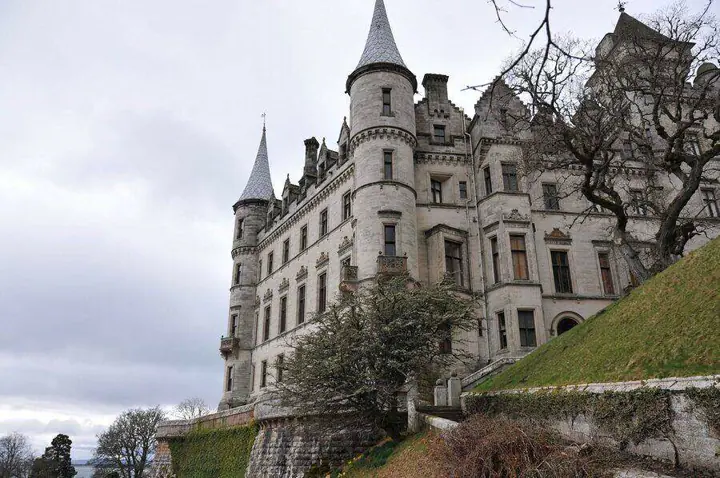 Dunrobin Castle turrets and tall windows viewed from below