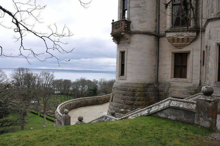 Stone terrace staircase beside Dunrobin Castle with the sea beyond