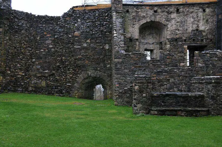 Inner wall with a large fireplace recess at Dunstaffnage Castle