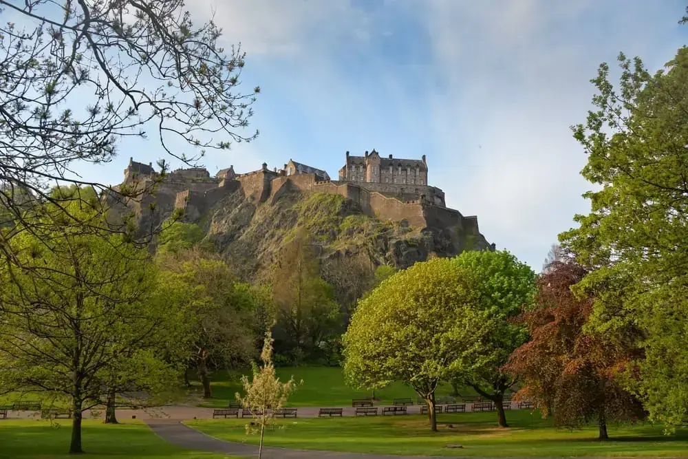 Edinburgh Castle and Castle Rock framed by trees