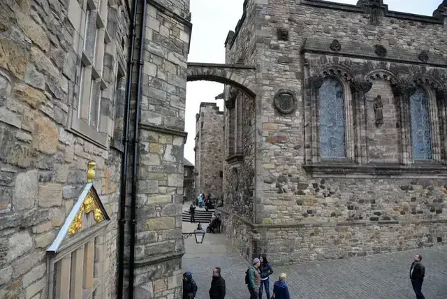 A narrow stone passage between historic buildings at Edinburgh Castle