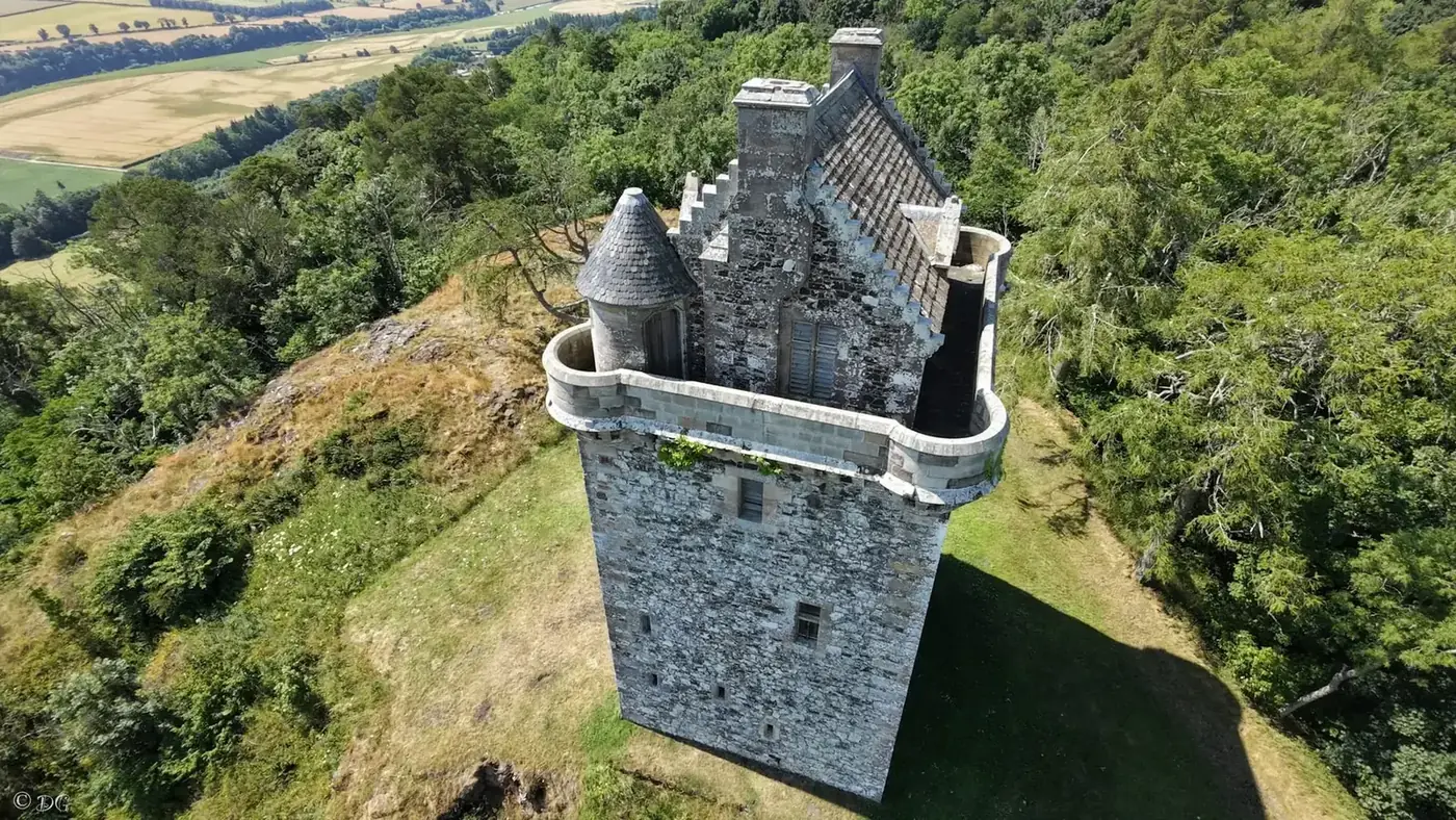 Close aerial view of Fatlips Castle roof and rounded parapet