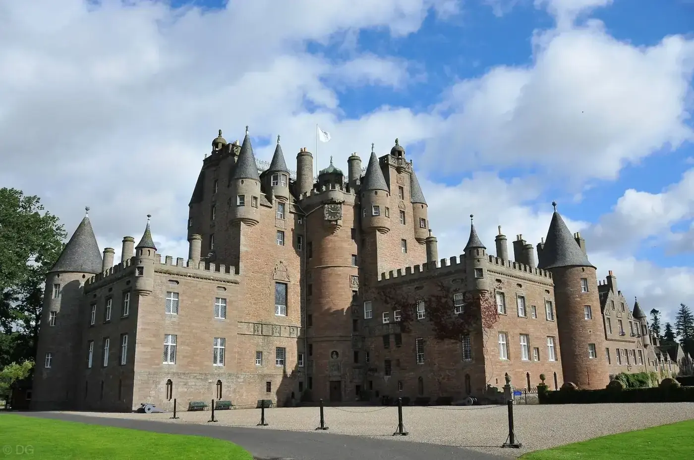 Glamis Castle towers and turrets above its gravel forecourt