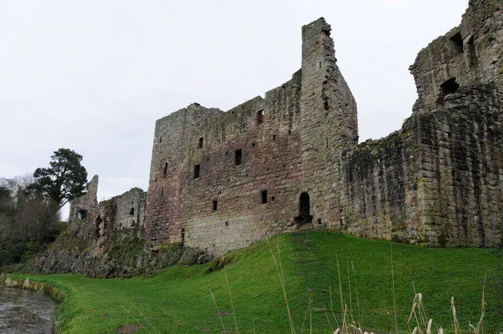 Ruined gable and window openings above the riverbank at Hailes Castle