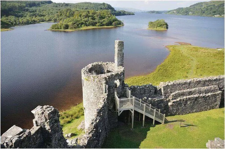 Kilchurn Castle round tower and wooden stairs overlooking the lake
