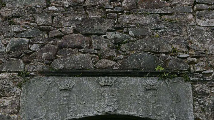 Weathered carved stone panel at Kilchurn Castle