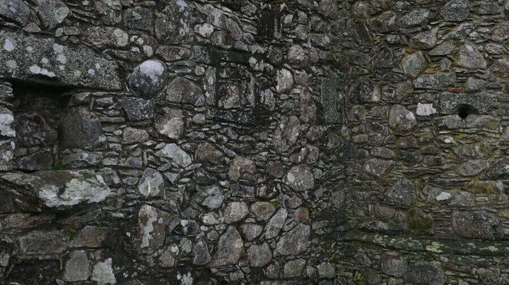Stone arch filled with masonry inside Kilchurn Castle