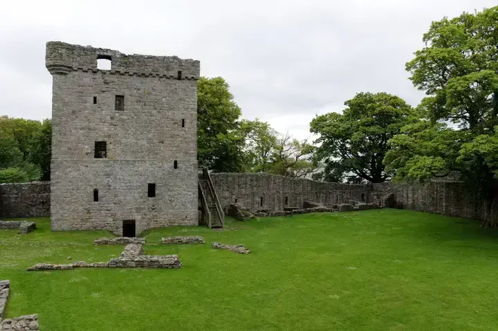 Loch Leven Castle tower and stone foundations across the courtyard