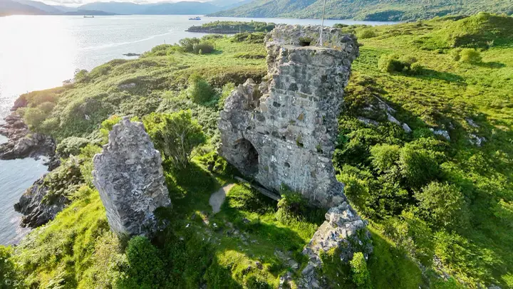 Aerial view into Maol Castle ruins beside the coast