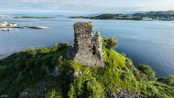 Aerial view of Maol Castle with buildings along the opposite shore