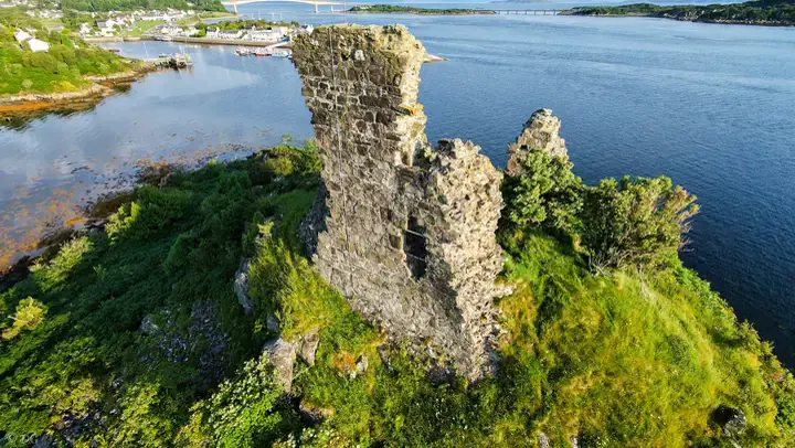 Close aerial view of the jagged stone walls of Maol Castle