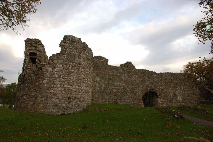 Old Inverlochy Castle round tower beside an arched doorway