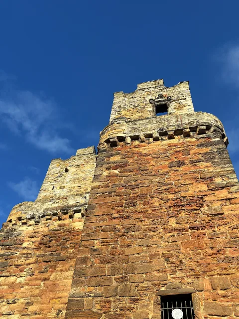 Preston Tower seen from below against a blue sky