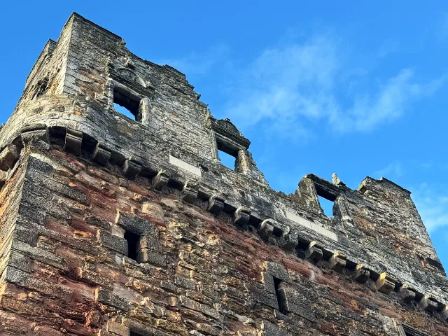 Upper windows and projecting corbels of Preston Tower