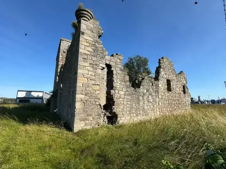 Rosyth Castle's ruined gable wall with a projecting corner turret