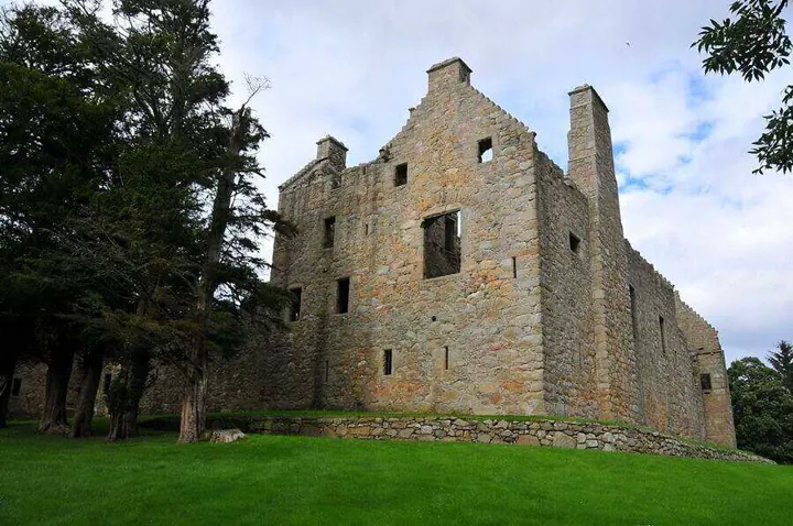 Tolquhon Castle outer wall with a stepped gable and tall chimney