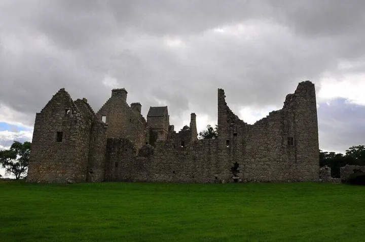 Roofless range of Tolquhon Castle with broken gables and open windows