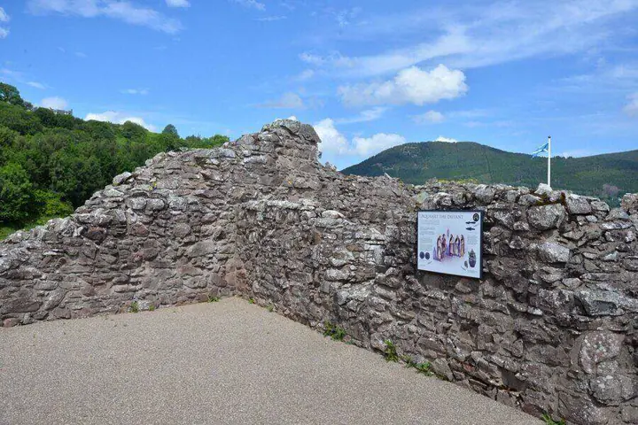 Information panel on a ruined wall at Urquhart Castle