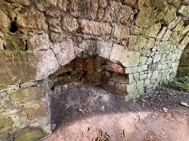 Fireplace opening in the ruined stone wall