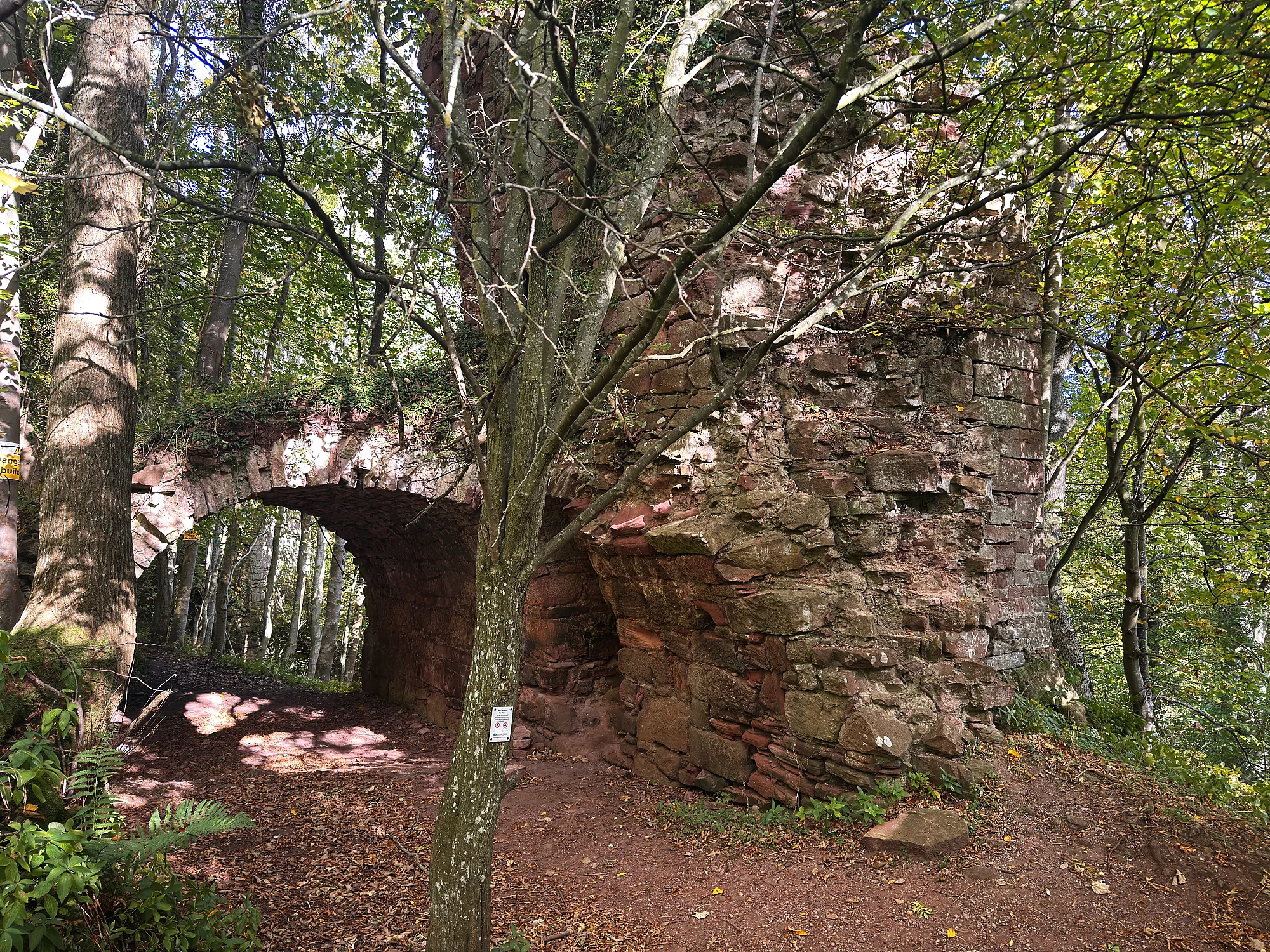 Yester Castle ruins and archway among trees