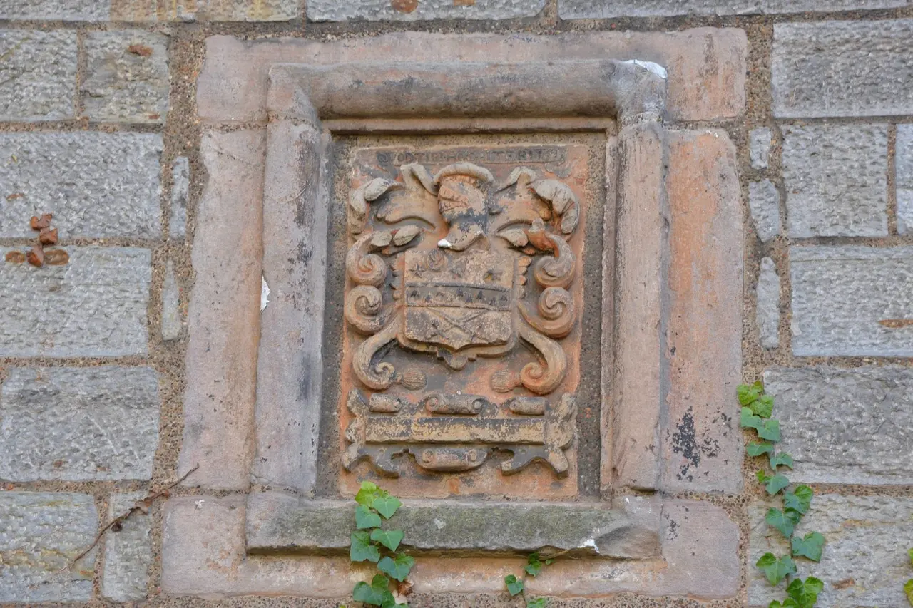 Carved stone heraldic panel on a wall at Lauriston Castle