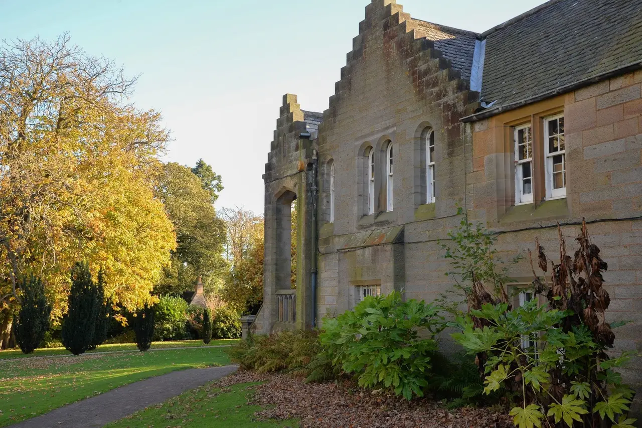 Stepped gables and pale stone windows beside the garden at Lauriston Castle